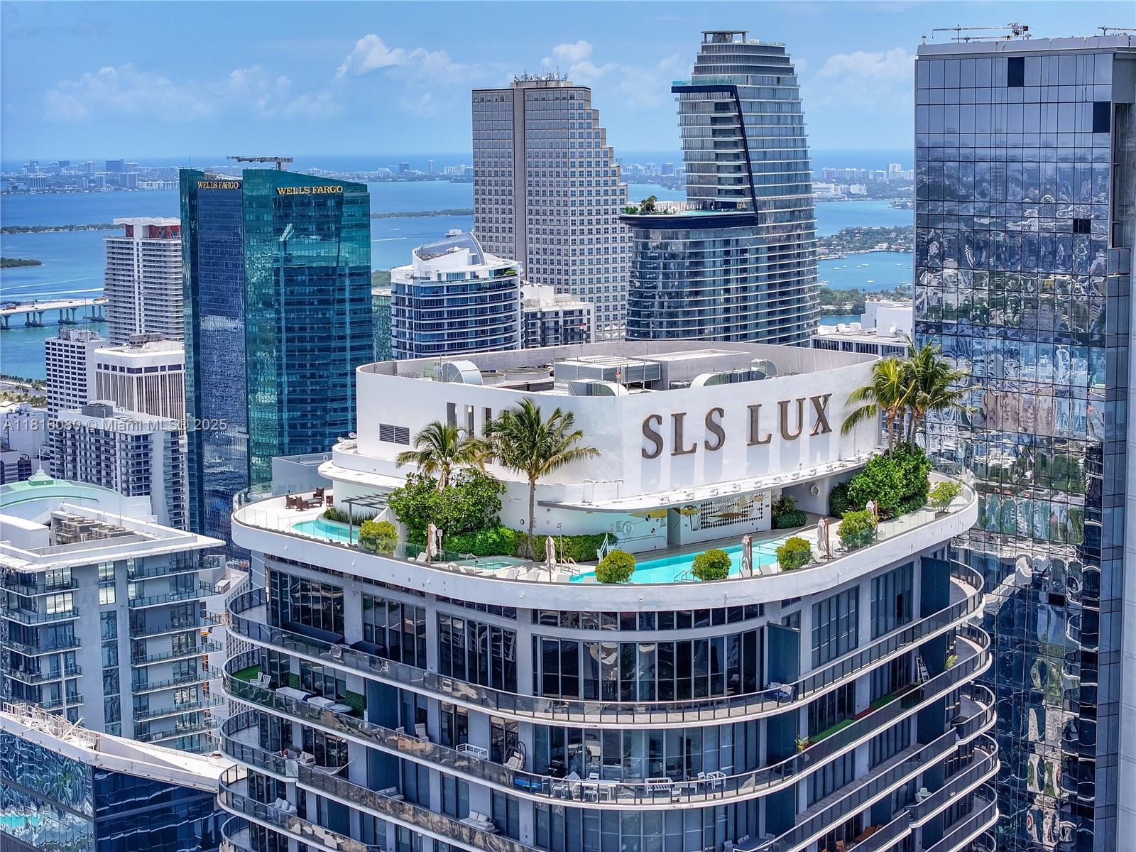Spectacular 4,247 SF upper penthouse with 4BD and 5.5BA in SLS LUX, in the heart of Brickell Area. Large wraparound balconies overlooking Biscayne Bay & Miami Skyline. Glass elevator access the rooftop with private pool and barbecue area that provides unparalleled sunrise and sunset Miami Skyline views. The open layout includes 11 ft ceilings, Odysseus Moca Creme stone flooring, eat-in kitchen boasts custom Italian cabinetry, marble countertops, expansive center island, and high-end Wolf and Subzero appliances, automated shades, barbecue, 2-car lifts garage (4 spaces) and many on-site spectacular amenities and design inspired by iconic SLS LUX lifestyle.