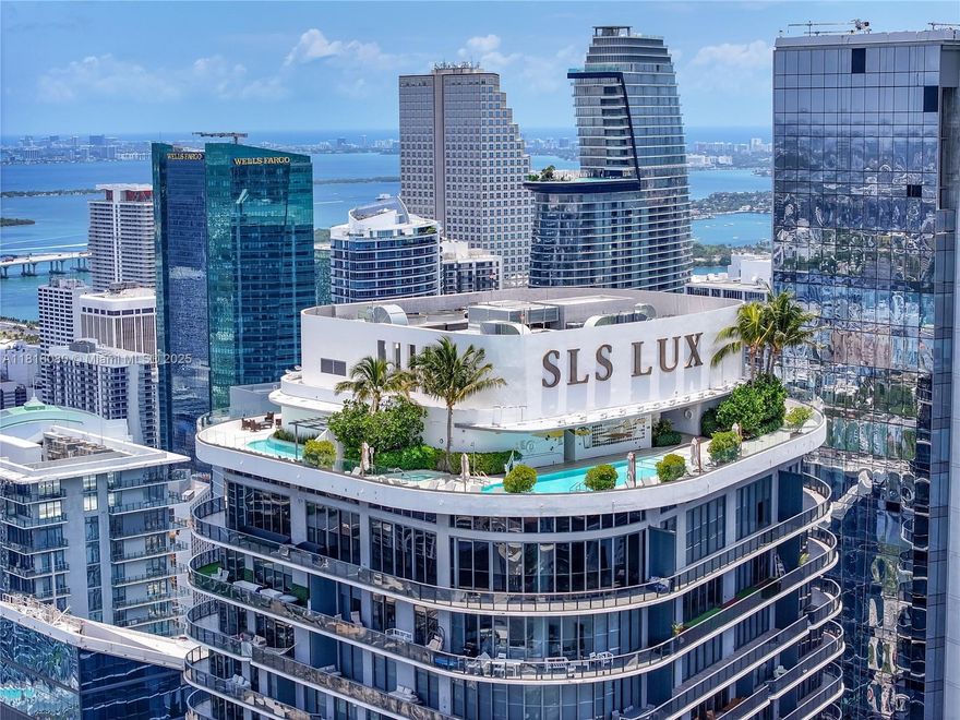 Spectacular 4,247 SF upper penthouse with 4BD and 5.5BA in SLS LUX, in the heart of Brickell Area. Large wraparound balconies overlooking Biscayne Bay & Miami Skyline. Glass elevator access the rooftop with private pool and barbecue area that provides unparalleled sunrise and sunset Miami Skyline views. The open layout includes 11 ft ceilings, Odysseus Moca Creme stone flooring, eat-in kitchen boasts custom Italian cabinetry, marble countertops, expansive center island, and high-end Wolf and Subzero appliances, automated shades, barbecue, 2-car lifts garage (4 spaces) and many on-site spectacular amenities and design inspired by iconic SLS LUX lifestyle.