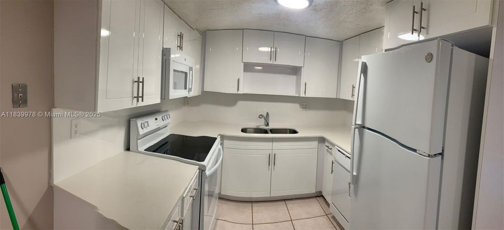 Photo of 11101 Royal Palm Blvd #113, Coral Springs, FL 33065 (MLS # A11839978)
