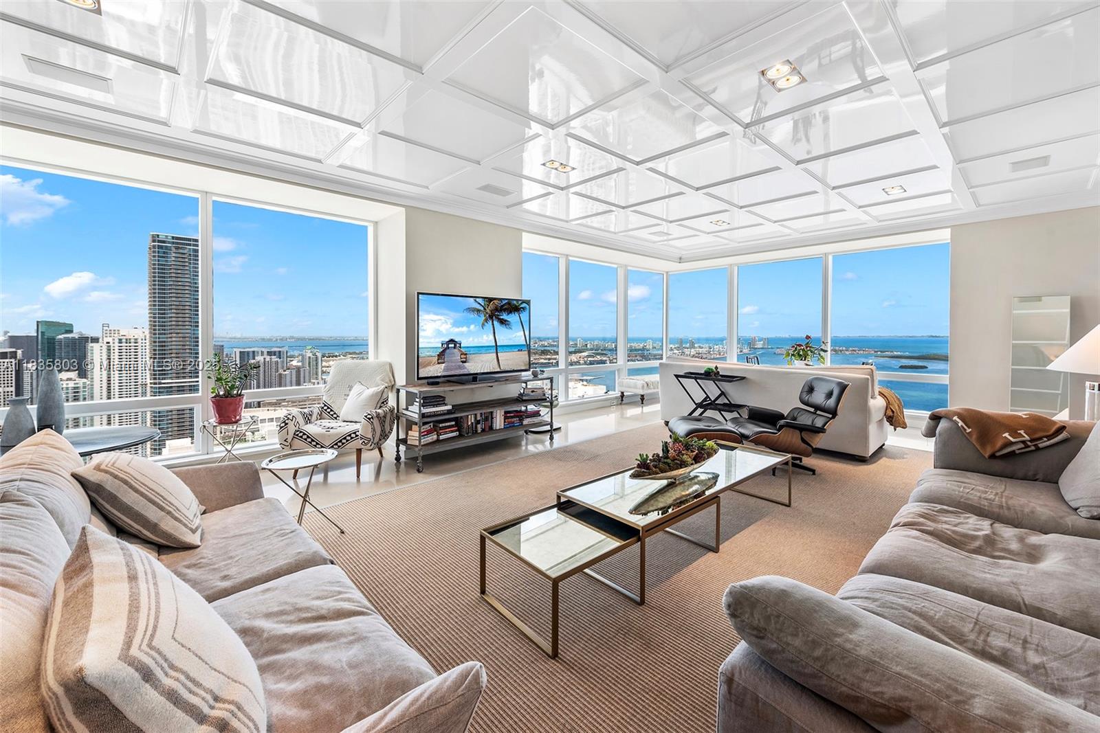 Experience unparalleled luxury in this stunning 3,357 sq/ft, 3-bedroom + Den, 4-bathroom corner unit at the Four Seasons in Brickell, perched on the 58th floor. Boasting breathtaking panoramic views, this residence offers an exquisite blend of elegance and comfort. Wood and marble floors lead you through a spacious open-concept living area, bathed in natural light from floor-to-ceiling windows. Each bedroom is a private oasis, featuring en-suite bathrooms and ample closet space. The gourmet kitchen is a chef's dream, equipped with top-of-the-line appliances and sleek finishes. Enjoy world-class amenities, including 24-hour concierge, spa, fitness center, and fine dining.