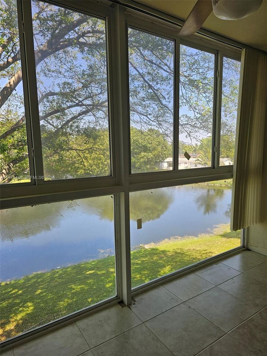 Take in the breathtaking Lake view as you enter this Modernized 2/2 55+ Condo on 3rd floor. Move in ready to enjoy the tranquil lake view from living room, primary & balcony. Eat in kitchen, new stove, newly remodeled baths, new water heater, 2024 AC, glassed in balcony/sunroom to relax enjoying stunning sunsets. Tile floors, newly carpeted bedrooms, impact windows, LOW $529 per month maintenance. Well maintained building, management company. Laundry facilities & storage on floor, tennis, shuffleboard, pool, gym, community room, BBQ, picnic area, trash chute, 1 assigned parking spot, international neighbors, close to shopping.