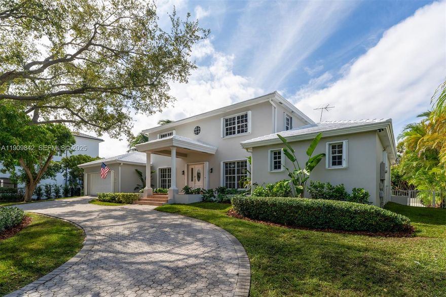 Discover elegant waterfront living in this Gables by the Sea residence on an 18,150 sq. ft. lot with no bridges to the bay. This 2-story 6-bedroom, 5-bath home features, primary suite on ground level, vaulted ceilings, skylights, and freshly painted interiors and exteriors that radiate warmth and sophistication. The open layout flows to a screened-in patio, ideal for entertaining or relaxing. A private 1-bedroom, 1-bath guest house with a kitchenette offers comfort for guests or in-laws. Enjoy ocean breezes, water views, a large dock with 30 amps connection with direct bay access, and close proximity to excellent schools.