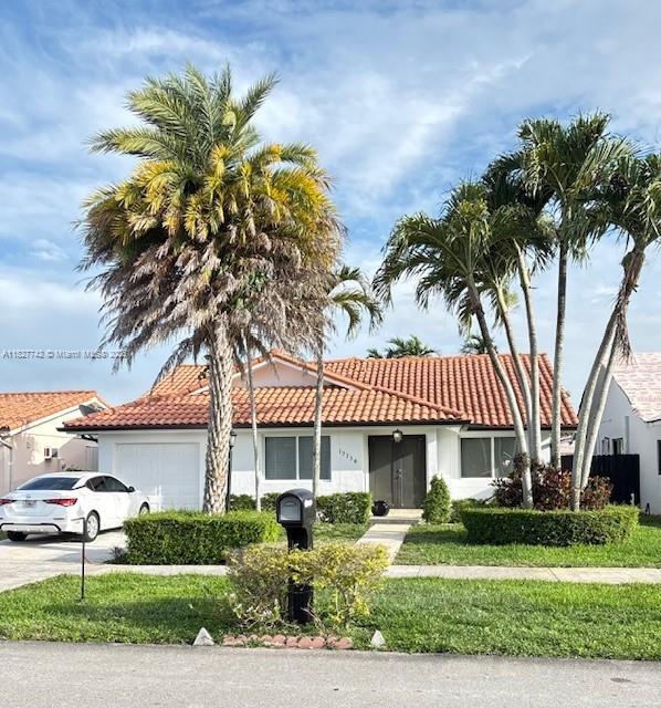 Lovingly maintained 3/2 with updated bathrooms and kitchen, tile throughout, nice fenced in yard, hurricane impact windows and doors, garage with extra storage space.