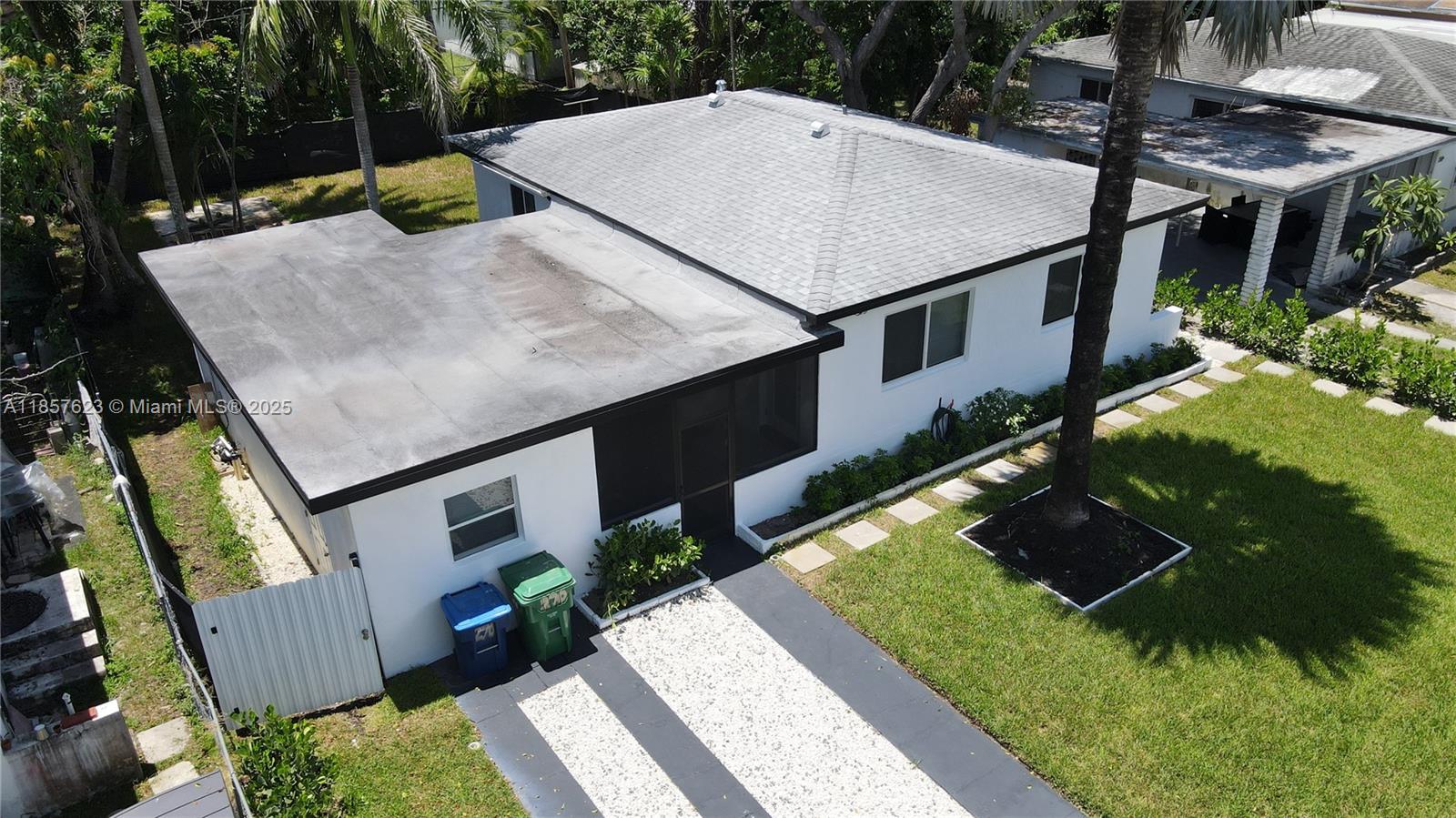 HIDDEN GEM with a MOTIVATED SELLER!!! Beautifully renovated 3/2, with a detached 1/1 studio apartment with its own private entrance. Perfect to use for extra income or as an Airbnb. Spacious backyard with mango trees and enough room to add a pool. Located just minutes away from beaches, major expressways, shops, restaurants, and Publix. This property is a must SEE and will go fast, so HURRY!