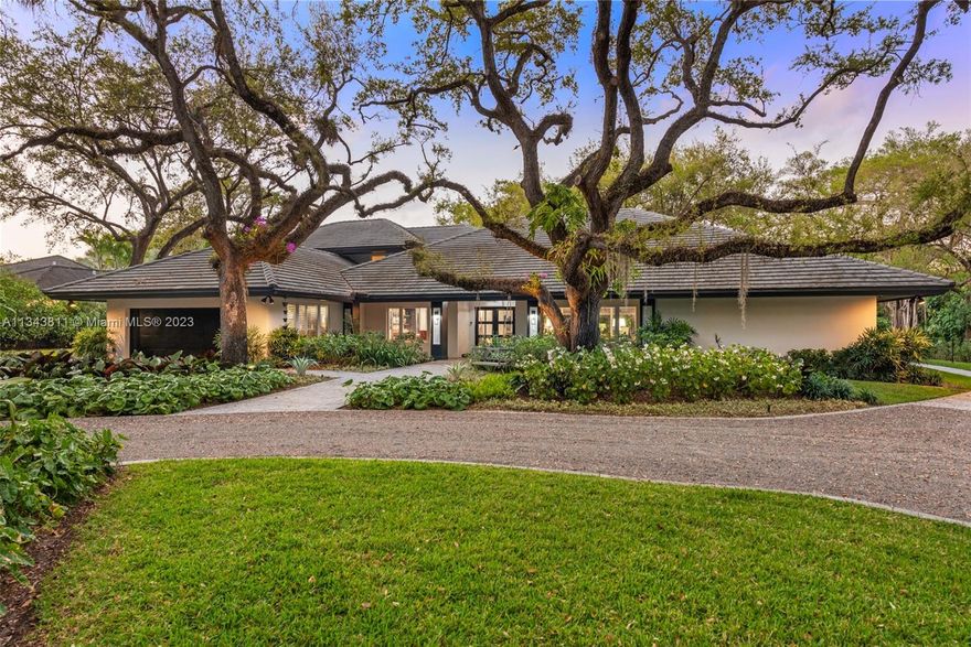 Past the gates of treasured Hammock Lakes, at the end of one of Miami's most beautiful streets is a gated timelessly updated home whose beauty radiates from the inside out. Refined sophistication greets you in a formal foyer, coffered ceilings w/ inlaid moldings catch the eye, custom built-ins adorn the walls, oak wood floors cast a warm richness, and a flawless floor plan offers ease of living. Carrera marble chef's kitchen w Sub Zero fridge, Thermador appliances w gas range, designer lights, Dornbracht and Kohler fixtures, surround speakers, Control 4 system, dual high capacity wine fridges, marble baths & sumptuous primary suite are just the start. Outdoor updates include ipe deck, leathered marble summer kitchen, 1000 gallon buried generator, pickleball court, new front gate. Dreamy!