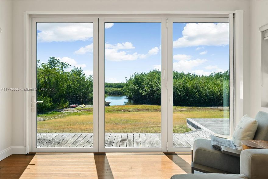 120 Coco Plum Drive is an enchanting Key Largo waterfront home situated on nearly 2 acres of tropical landscaping. Its charming layout provides ample space for your family and guests. Inside this 3-bedroom, 2.5-bathroom home, you'll enjoy the airy, open-concept design, which features clean lines and light-filled spaces, seamlessly blending indoor comfort with a large, covered center courtyard leading to an outdoor sanctuary. At the heart of the home is an open kitchen with a spacious island that serves as a focal point for entertaining and casual family gatherings. You will find room for all your recreational toys and convenient car charging in the garage and porte-cochere. Stepping outside to the backyard, you'll find a tropical waterfront setting with access to the Atlantic Ocean.