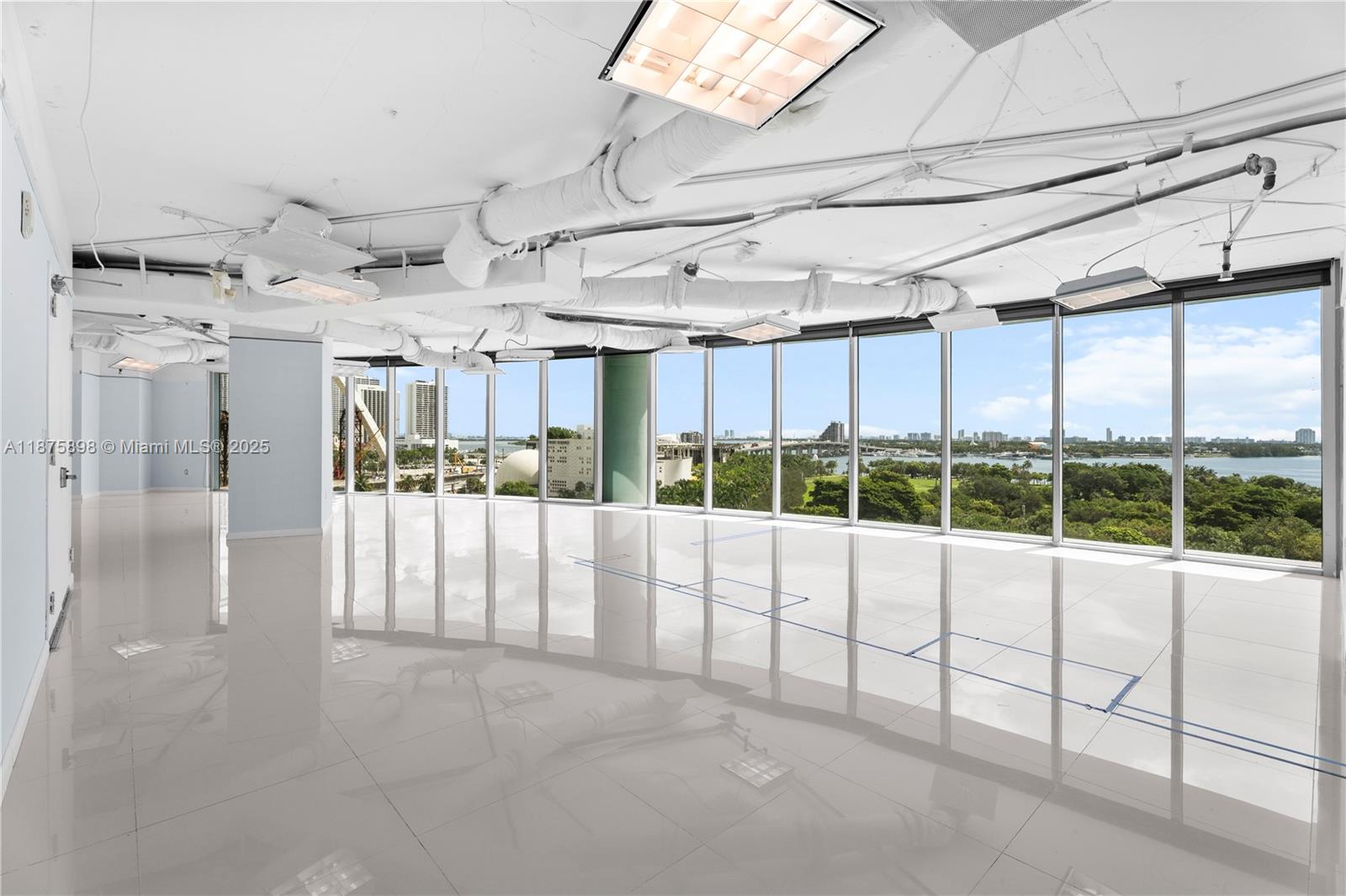 Premium office space available at 900 Biscayne in Miami’s Arts & Entertainment District, directly across from PAMMand Museum Park. This 2,493 SF suite is thoughtfully configured with 4 private offices and open work areas to accommodate a variety of business needs. Expansive floor-to-ceiling windows showcase sweeping Biscayne Bay views, filling the space with natural light and creating an inspiring work environment. The building offers secure access, professional management, and onsite valet parking, with close proximity to dining, business hubs, and major transportation routes. Ideal for corporate headquarters, professional firms, or growing enterprises seeking a prestigious address. Available immediately.