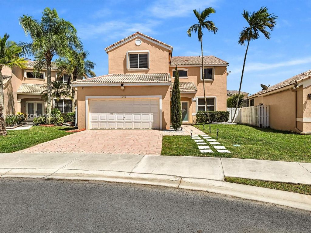 Photo of 1042 Thistle Creek Ct, Weston, FL 33327 (MLS # A12001294)