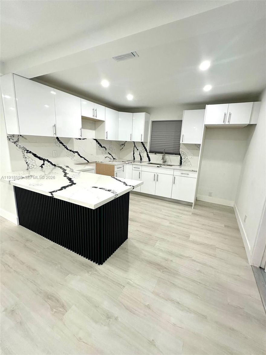 Fully Renovated and Updated. Home features 3 Bedrooms, 2 Bathrooms, Car Garage, Car Port and Paved Driveway, Sitting in a large Corner Lot. Roof is in great shape, New impact windows replaced with permits. New Kitchen Cabinets with Exotic Quartz Tops, New Bathrooms New Floors. Seller will place New Appliances before closing, Refrigerator, Stove and Microwave. Your buyers will love this property...