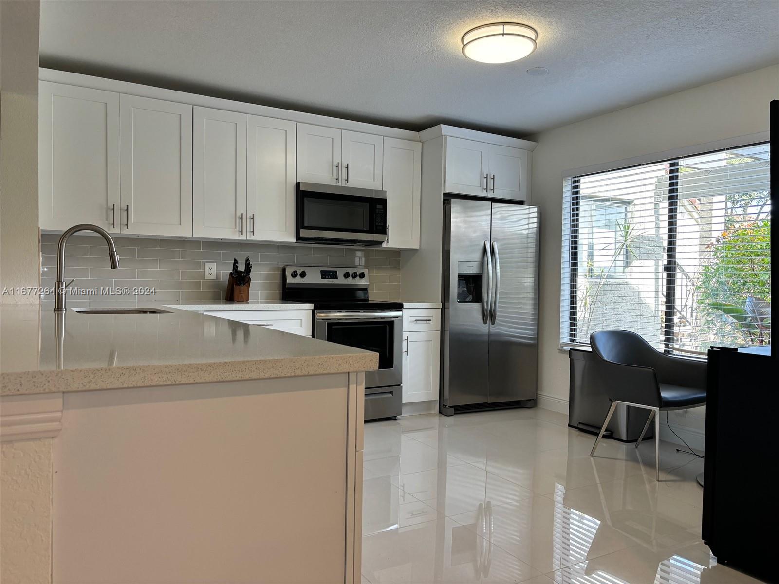 GORGEOS COMPLETELY RENOVETED ground floor 2 bed 2 bath. Brand New Everything. A true open concept perfect for entertaining! Custom white oak Shaker cabinetry with QUARTZ Countertops, designer subway tile backsplash + STAINLESS STEEL gallery appliances! Very spacious living area & master bedroom w/ closet! Bathrooms completely renovated including dual sinks and frameless shower glass! Brand new 2023 AC! Washer/dryer in unit! Enjoy Florida afternoons on your private screened-in lanai! Unit also has a private deeded storage room. Community pool just steps away!
Gated 55+ community close to all great restaurants & shops in the area, close to vibrant Downtown Delray and beaches!!!