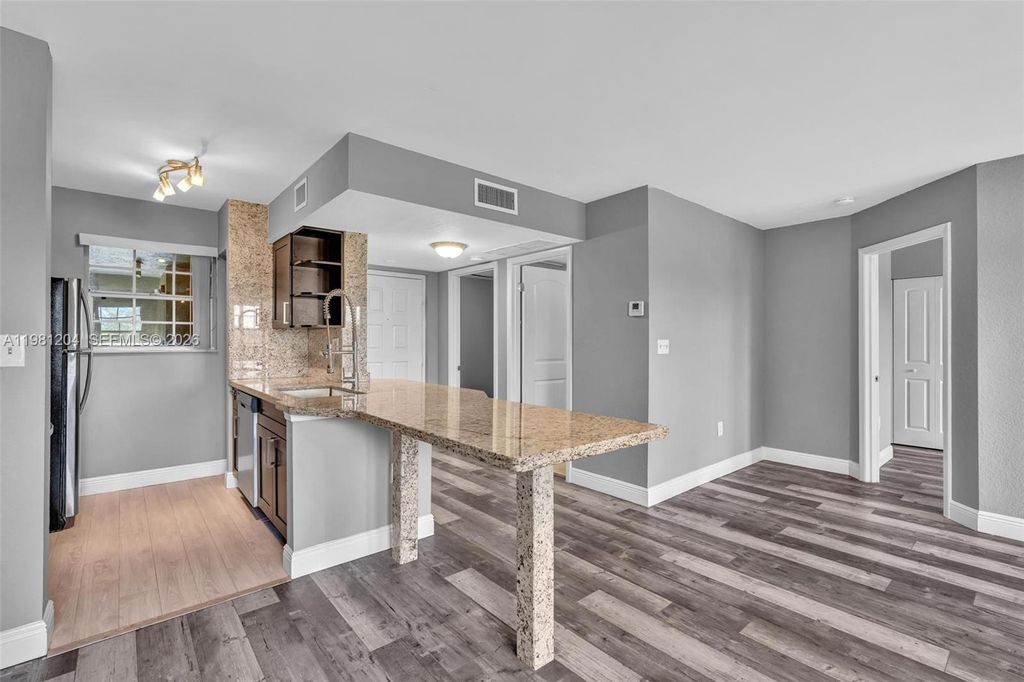 Photo of 2871 N Oakland Forest Dr #204, Oakland Park, FL 33309 (MLS # A11981204)