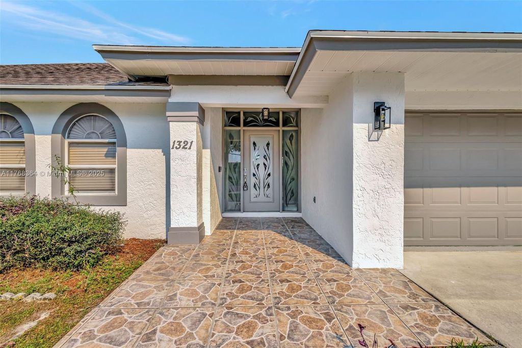 Photo of 1321 SE Airoso Blvd, Port Saint Lucie, FL 34983 (MLS # A11768364)