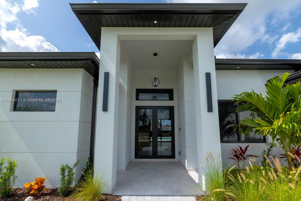 MOTIVATED SELLER!!!***WELOME TO YOUR NEW HOME*** Discover this newly built home offering 3 bedrooms + a versatile den , 3 full bathrooms, and a thoughtfully designed layout that blends style and functionallity. Located in a great area , this property features an open-concept living area , a modern kitchen with quality finishess , and an indoor bar perfect for entretaining guests or enjoying quiet evenings at home. This great house includes walk-in closets , a generous master bedroom with its masterbathroom and 2 garage spaces for convenience.Step outside to enjoy the private pool , idel for relaxing or weekend fun in the sun. This excellent home combines comfort , modern designed , and the best of Florida living. Schedule your showing today and make this your new home in Cape Coral!