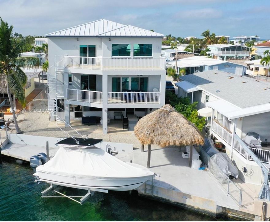 Own a slice of Paradise. Discover one of the finest estate homes in the sought-after community of Tavernier. Perfect as your primary residence or a dream vacation getaway. This three-story masterpiece offers unparalleled luxury. Complete with a private elevator for easy access to every level. Boasting 5 spacious bedrooms and 3 elegantly designed bathrooms, this home is ideal for entertaining family and friends. The fully equipped kitchen features modern stainless steel apppliances, making meal preparation a delight. Relax and unwind as you take in breathtaking sunset views from your private sanctuary. Step outside to enjoy a 60- dock, providing direct access to world class fishing, snorkeling, diving, swimming, and boating. Owner financing is available, or a yearly lease.