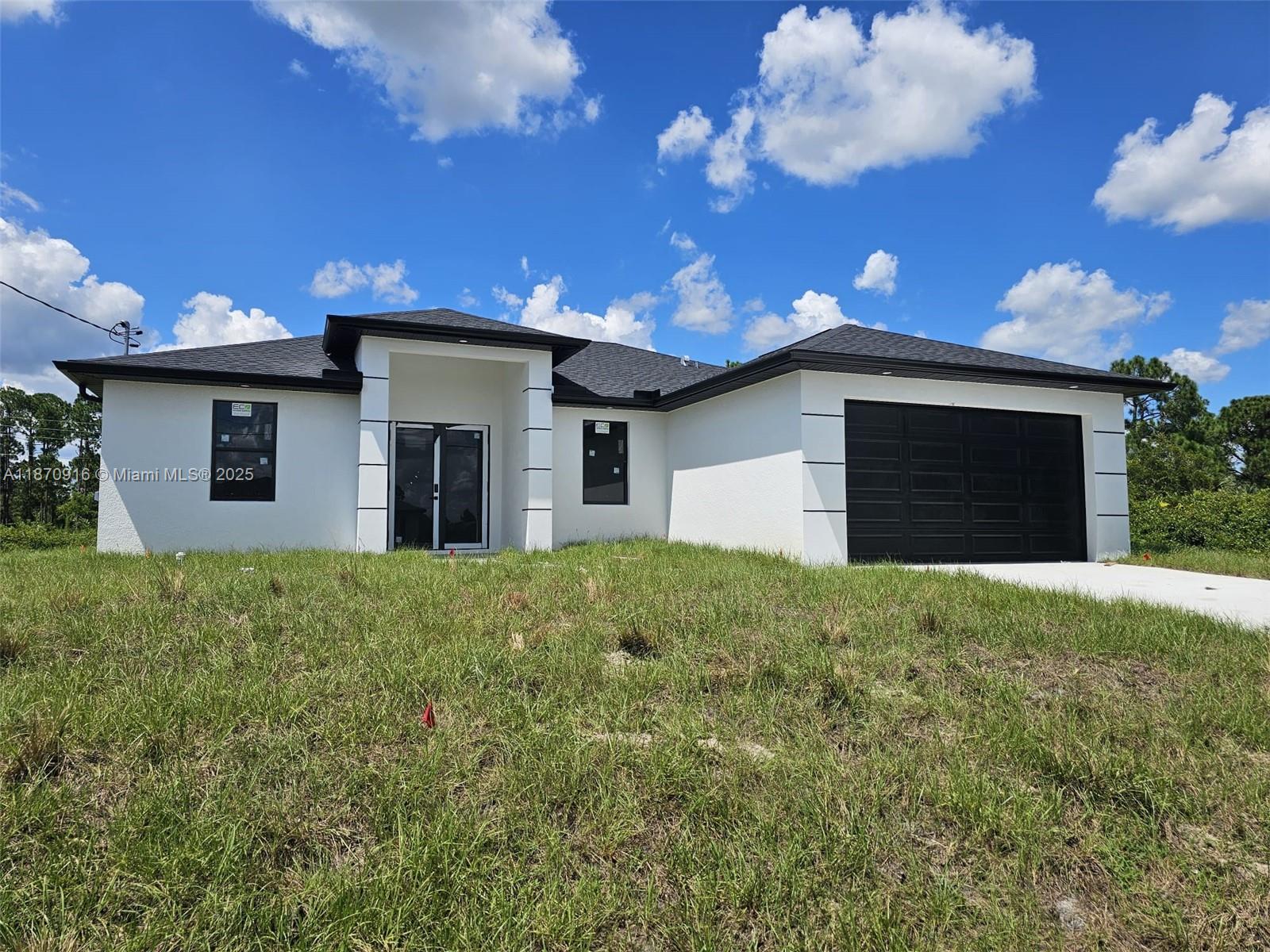 Be the first to call this brand-new 3-bedroom + den, 2.5-bath home yours in the sought-after Lehigh Acres. Sitting on a spacious 0.25-acre lot, this modern residence features sleek tile flooring, a stylish master suite with dual sinks and walk-in shower, and brand-new appliances including refrigerator, microwave, stove, washer, and dryer. With an open patio perfect for gatherings, this move-in ready home offers comfort and elegance in every detail. Schedule your showing today!