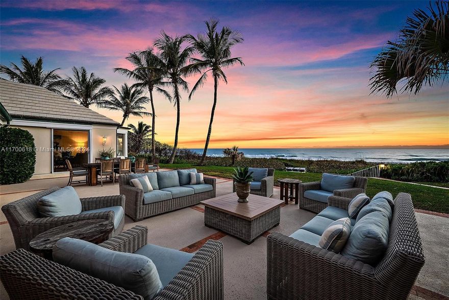 Discover an exclusive beachfront retreat on ±1.6 acres, boasting 170 feet of ocean frontage and a rare 23.5 feet high-elevation location. This Bermuda-inspired main house includes 4 bedrooms and 4 bathrooms, with expansive living, dining, and family rooms that showcase sweeping views of a pristine private beach through large glass doors. An expansive terrace creates a seamless indoor-outdoor flow, perfect for entertaining or quiet family gatherings. A separate guest house adds an extra bedroom, bathroom, walk-in closet, living room, and kitchen. The 3-car garage offers a half bathroom and large walk-in storage closets. With room for future expansion, this property combines coastal luxury with privacy for the ultimate beachfront living experience.