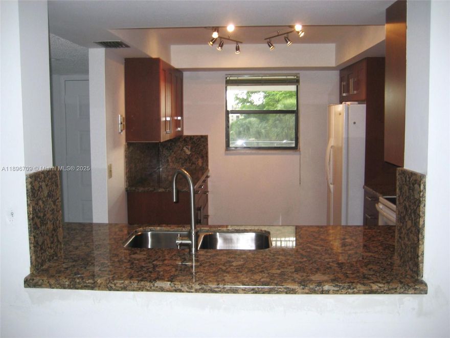 Enjoy a peaceful golf view from your screen balcony from this beautiful updated 2-bedroom, 2-bathroom condo. The kitchen features granite countertops and plenty of cabinet space. Also, you have a storage cage. As a resident, you'll have access to the Bonaventure club, offering a wide range of amenities including a fitness center, racquetball and tennis courts, basketball, swimming pool, skating, bowling alley, and daily activities for all ages.