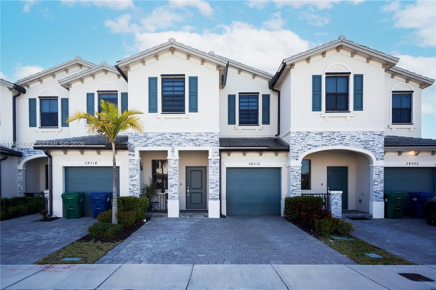 Welcome to this beautifully updated 4-bedroom, 2.5-bathroom townhouse located in the desirable Pine Vista community in Homestead. This spacious residence features an almost entirely remodeled interior with elegant vinyl flooring throughout, creating a modern and cohesive look. The kitchen is equipped with modern appliances, including a wine cooler, and offers an extended pantry for added storage and convenience. The open layout provides comfortable living and dining areas, ideal for everyday living and entertaining. Step outside to a thoughtfully designed concrete patio featuring turf and decorative stone elements, offering a low-maintenance and stylish outdoor space. This property also includes access to community amenities such as a clubhouse, pool, fitness center, and landscaped common areas. Conveniently located near major roadways, shopping, dining, and recreational options. Move-in ready and designed with both comfort and functionality in mind.