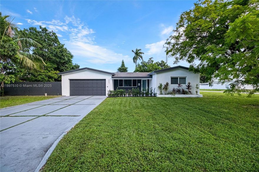 Located on a desirable corner lot, this beautifully remodeled 3-bedroom, 2-bath Miramar home is move-in ready. It features impact windows, a spacious 2-car garage, and an oversized driveway. Inside, the bright open layout showcases sleek white porcelain floors, warm laminate in the bedrooms, and stylish designer lighting. The kitchen includes high-end appliances, rich ebony cabinets, and quartz countertops, while both bathrooms offer elegant finishes and a spa-inspired primary suite with double sinks, Italian porcelain, and a steam shower. Set in a quiet no-HOA neighborhood near shopping, dining, and major highways, this home also features a large fenced yard with mature fruit trees and space for a boat, perfect for entertaining or relaxing outdoors. Available furnished or unfurnished.