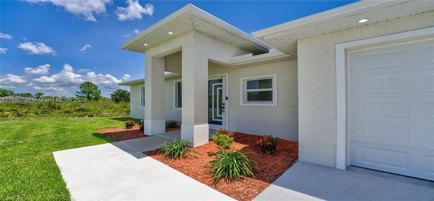 Brand new construction ready to move in! This beautiful 3-bedroom, 2-bath home features a modern open-concept layout with high ceilings that enhance the sense of space and natural light. The property showcases a contemporary front entrance that adds great curb appeal. Enjoy tile flooring throughout for durability and easy maintenance. Impact-resistant windows and doors provide added security and energy efficiency. The home also includes a one-car garage and a backyard, ideal for outdoor activities or future improvements. With 1,169 square feet of well-designed living space, this home offers the perfect blend of style, comfort, and functionality in the growing area of Lehigh Acres.