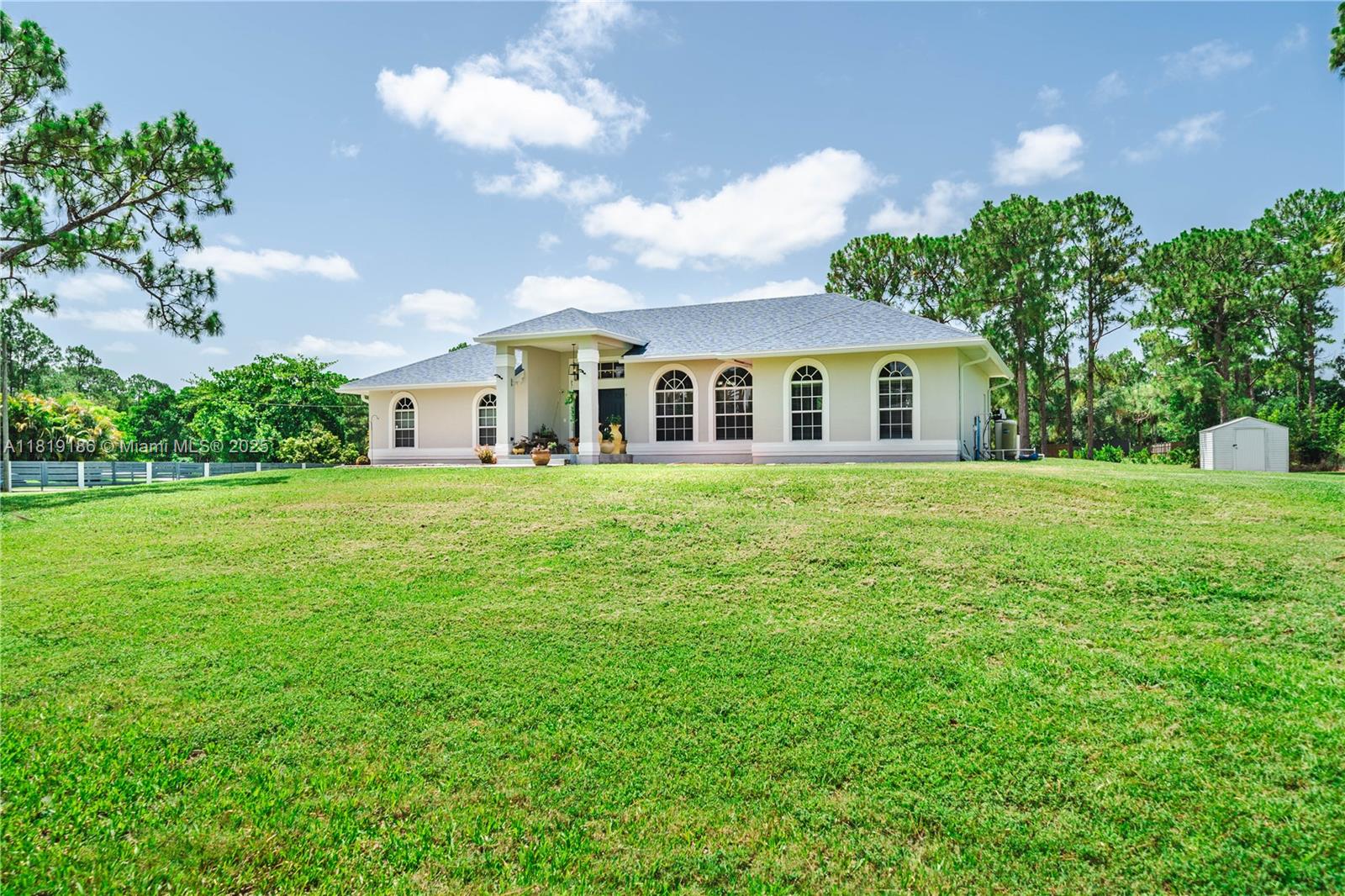 This Gorgeous Home Situated on over 1.20 Acre of land. Home had recently all Major items done **Roof 2023**Water Heater 2024**A/C 2022** Recently Purchased NEW washer and Dryer. Home Features an Abundance of Natural Light, the Feeling of Home is Immediately Felt Floor is tiled throughout With a Split floor Plan 4 Bedrooms & 2 Full Bathrooms. *NO HOA*, Minutes to A rated Schools and Shopping. This is YOUR DREAM OASIS IN THE HEART OF LOXAHATCHEE. Don't miss your opportunity to own an amazing home with a lot of land to make this home your​​‌​​​​‌​‌​​​‌‌​​​‌‌‌​​‌​​‌‌​​​​ own.