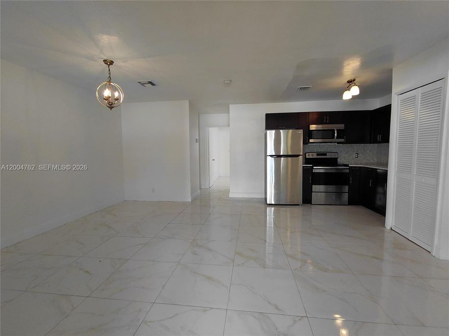 Spacious 2 bedroom, 1 bathroom unit available in a well maintained triplex. This property features central AC, new tile flooring, updated windows, and a fully renovated kitchen and bathroom. An indoor laundry hookup is included for added convenience. Water included.

Ideally located near schools, shopping, dining, and entertainment, with easy access to major roads and highways.

Background and credit check required. Three months total move in cost. Section 8 welcome.