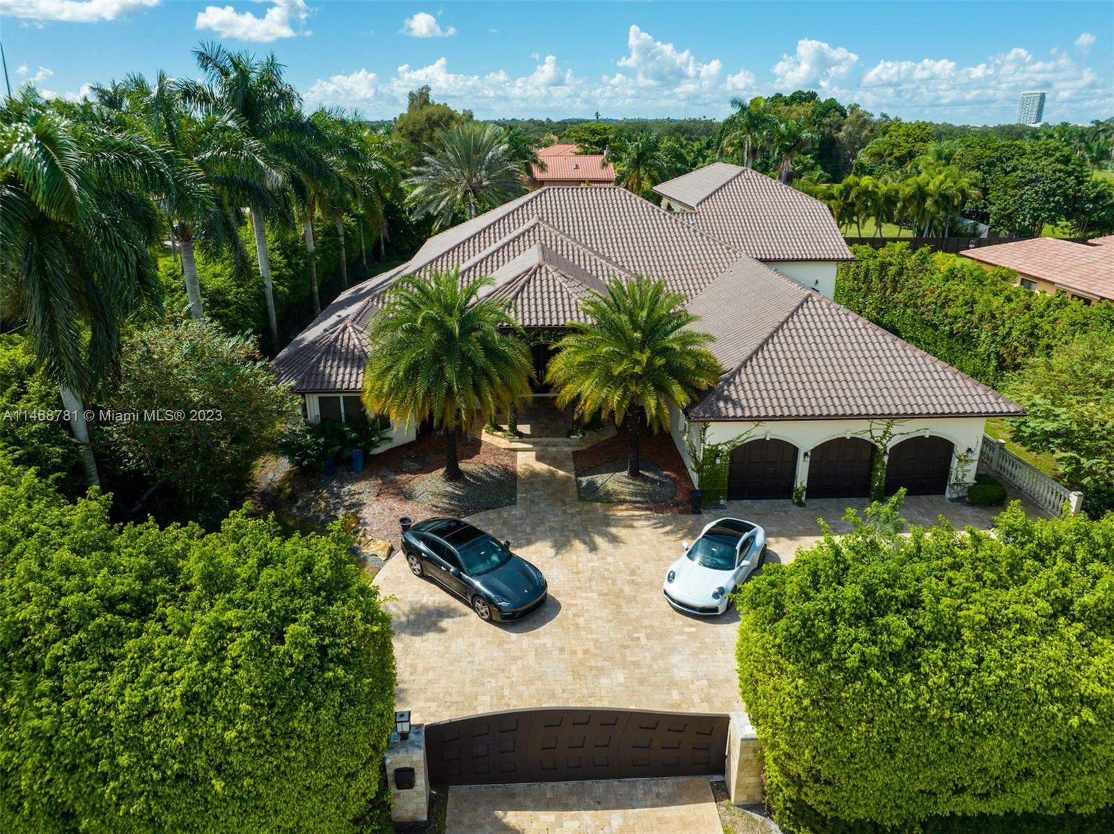 One of a kind Estate in Plantation, FL! This beautiful home is the definition of luxury featuring 5 bedrooms 5 baths and a complete in law suite. As you walk into this home you can't help but notice the beautiful mother of pearl accent wall, top of the line finishings starring designer brands such as FENDi, unbelievable kitchen with high end appliances such as Wolf and SubZero, High ceilings, and an amazing movie theater. The outdoors is an amazing space perfect for having family and friends over featuring a putting and chipping green, pool , jacuzzi and basketball court. This gorgeous home is being offered with furnitures and perfect move in ready condition. You do not want to miss this amazing property. Come Schedule a tour today!