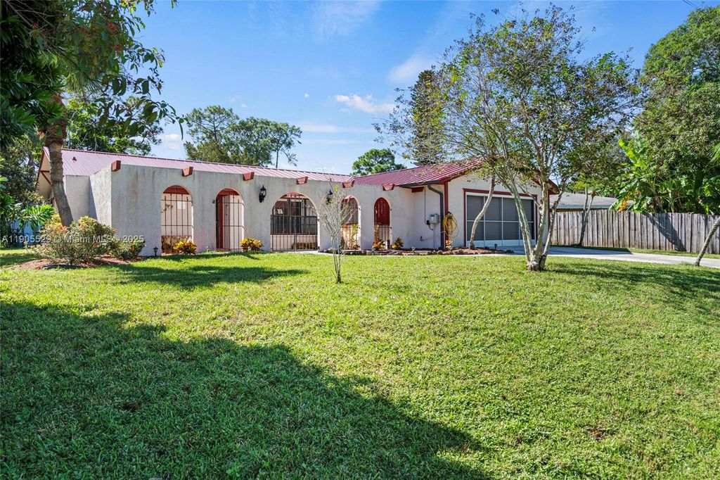 Photo of 310 SE Evans Ave, Port St Lucie, FL 34984 (MLS # A11905529)