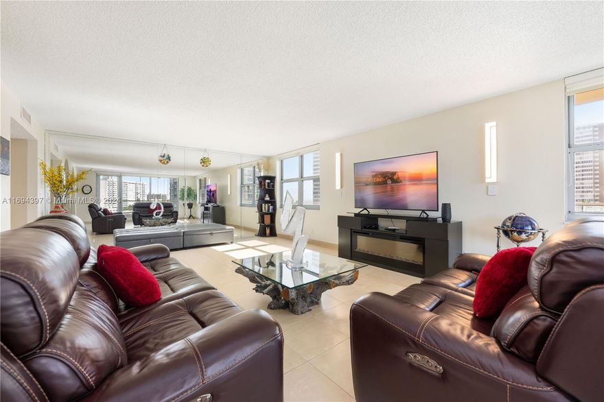 Stunning Corner Unit Condo, Largest in the Building and Steps from the Ocean! Experience luxury coastal living in this exceptional 2-bedroom, 2.5-bathroom corner unit condo, the largest unit in the building! Boasting an open and airy layout, this home is bathed in natural light through its expansive impact windows, offering breathtaking city and partial ocean views. flowing seamlessly into the spacious living and dining areas.  The primary suite is a private retreat with walk-in closet, , complete with its own full bath. A convenient half-bath adds extra functionality for entertaining. Enjoy first-class amenities, including valet parking, Located just steps from the beach, fine dining, and shopping, this one-of-a-kind residence offers unmatched space, style, and convenience.