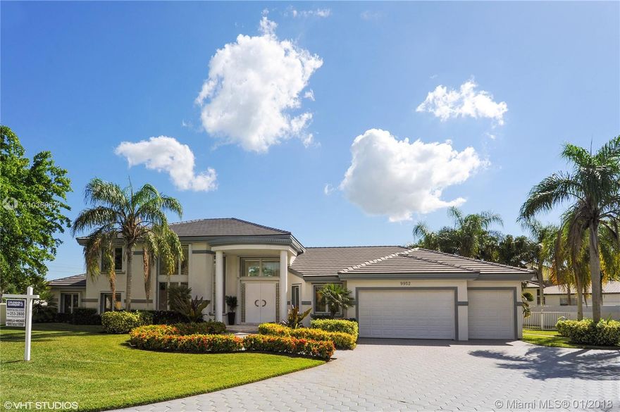 New flat tile roof 2017! Stunning two-story home perfectly situated on a peaceful cul de sac, boasts soaring ceilings with a wall of windows showcasing views of the pool, yard, and open sky. Brand new updates: accordion shutters, garage doors, PVC fence, blinds, floors, freshly painted exterior and interior, new sod, sprinkler system, and so much more!! Master bedroom features an en suite bath and glorious open balcony. This home offers a resort lifestyle with its expansive pool area and huge yard!