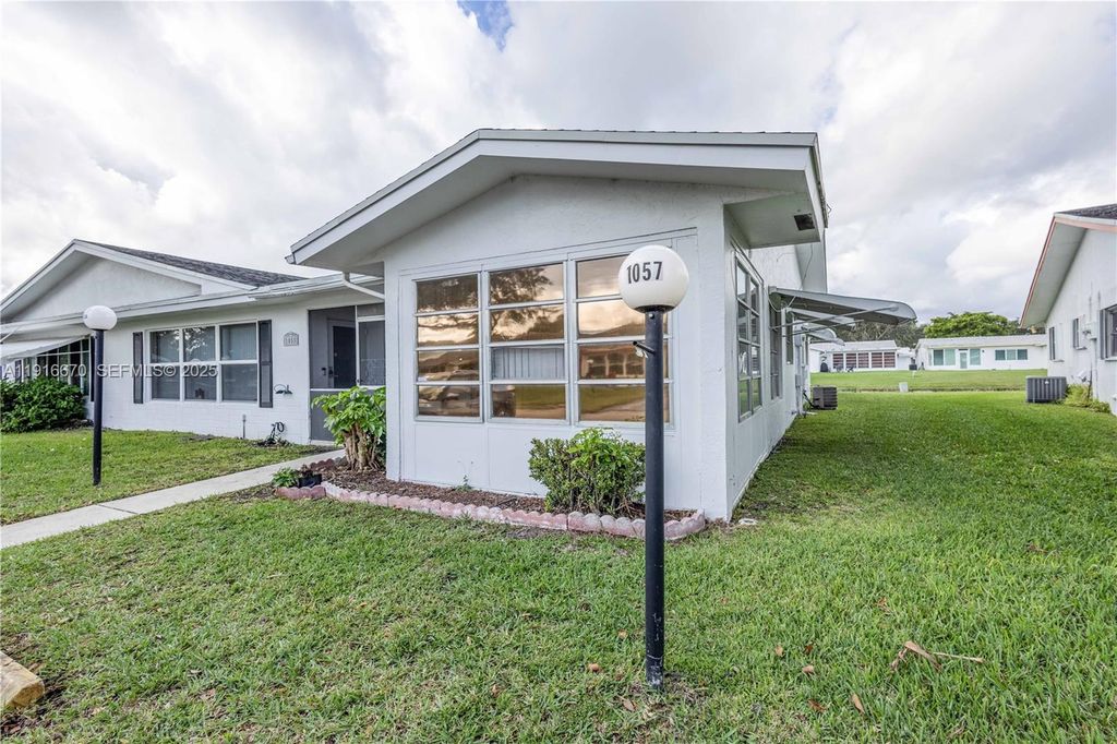 Photo of 1057 NW 88th Ave #D91, Plantation, FL 33322 (MLS # A11916670)