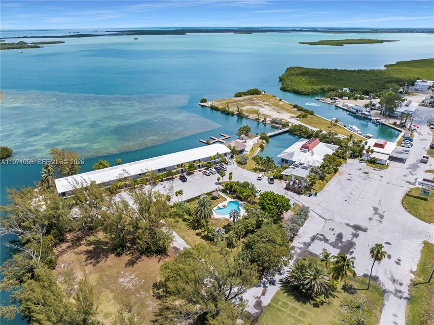 Iconic waterfront investment opportunity in the heart of the Lower Keys — Sugarloaf Lodge presents a rare chance to acquire one of the most recognizable hospitality properties between Key West and Marathon. Positioned on prime open water with protected dockage and sweeping sunset views, this legacy destination combines immediate income with significant redevelopment upside. The offering includes a 31-room existing hotel plus 24 vested development rights for a total of 55 hotel rooms at buildout. Improvements also include a hotel office/lobby, full-service restaurant, bar, tiki bar, marina facilities, 5 COP liquor license, commercial retail center, and a 3-bedroom residential apartment.Located directly on the Overseas Highway with exceptional visibility and boating access, the property attracts both drive-to and marine traffic. Guests enjoy immediate access to world-class fishing, diving, and backcountry waters, while the location offers convenient proximity to Key West.With flexible zoning and strong tourism demand in the Lower Keys corridor, the property offers multiple paths forward — reposition, renovate, expand, or reimagine into a boutique waterfront retreat. The combination of land value, dockage, and location creates long-term strategic upside for a savvy investor.
Confidential offering — qualified inquiries only.