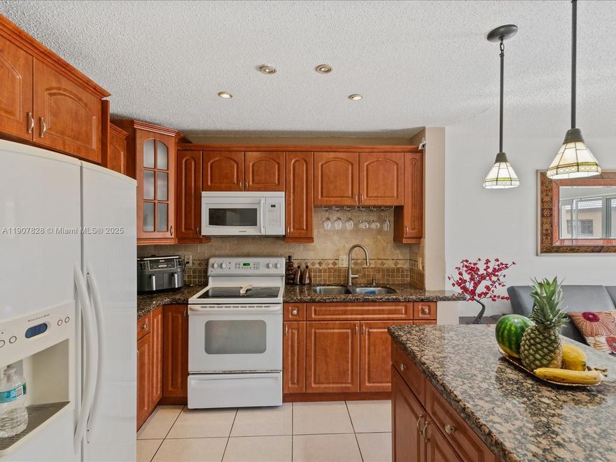 DELIGHTFUL 2-BED, 2-BATH CONDO LOCATED IN THE HIGHLY DESIRABLE COMMUNITY OF GRAND VISTA! ENJOY AN OPEN-CONCEPT LAYOUT THAT COMBINES THE FAMILY ROOM & KITCHEN, COMPLETE WITH GRANITE COUNTERTOPS, A CONVENIENT ISLAND, & PLENTY OF CABINET SPACE. STEP OUT ONTO THE OPEN BALCONY — PERFECT FOR RELAXING! THE SPACIOUS PRIMARY BEDROOM FEATURES A LARGE CLOSET & ENSUITE BATH. THE HOME INCLUDES A 2019 A/C UNIT, A 2021 WATER HEATER, & AN IN-UNIT WASHER & DRYER. 2 ASSIGNED PARKING SPACES & AMPLE GUEST PARKING MAKE DAILY LIVING EASY. LOW HOA FEES & NO RENTAL RESTRICTIONS OFFER GREAT FLEXIBILITY FOR BOTH RESIDENTS AND INVESTORS ALIKE. CENTRALLY LOCATED IN HIALEAH GARDENS WITH EASY ACCESS TO MAJOR HIGHWAYS, SHOPPING, AND DINING — A WONDERFUL PLACE TO CALL HOME OR A SMART ADDITION TO YOUR PORTFOLIO!