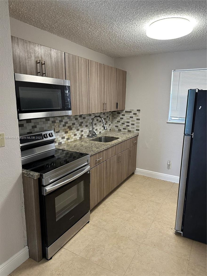 Renovated 2-Bedroom, 1-Bathroom Apartment for Rent in Pompano Beach! Beautifully updated apartment in a prime Pompano Beach location! Conveniently situated near I-95, shopping centers, and schools. This recently renovated unit features a modern kitchen with stainless steel appliances, Freshly painted, granite countertops, and an upgraded bathroom. Water is included in the rent. Quick approval for qualified tenants. Easy to show—schedule your viewing today!