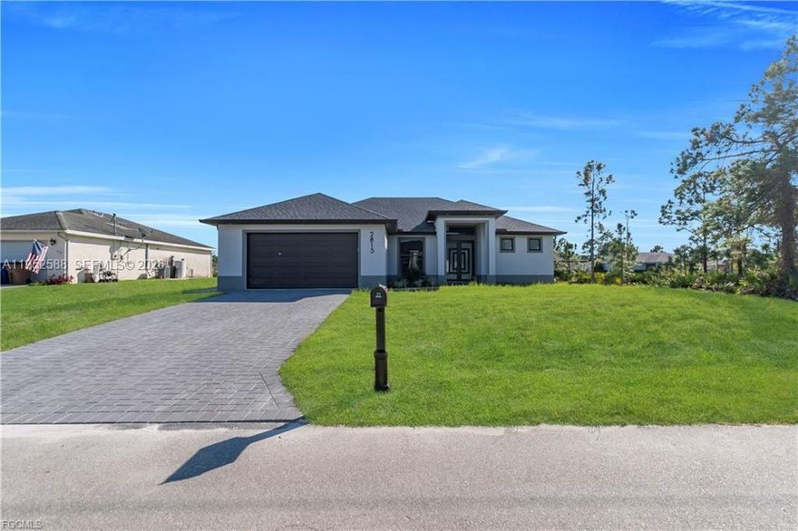 Modern home featuring high ceilings, underground electricity, and pre-installed electrical and plumbing connections in the garage ready for future use. Includes washer and dryer, with exclusive black quartz countertops on the kitchen island and all bathrooms for a touch of elegance. Impact-resistant doors and windows throughout, including the master bedroom and garage, offering safety and peace of mind. The property features a spacious den, a modern rain gutter system surrounding the roof, and a wide entry with a short hallway that opens into a bright kitchen and living area. Enjoy sleek, contemporary shower systems and a large office room separate from the other three bedrooms—perfect for remote work or creative projects. Equipped with a full sprinkler system and located in a rapidly growing residential neighborhood surrounded by new constructions, this home offers style, functionality, and comfort in one of the most desirable and expanding areas of the city