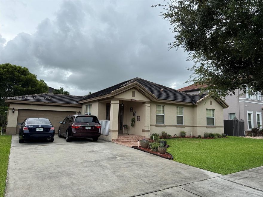 Well-maintained, one-owner home in very good condition, located in a desirable and peaceful neighborhood. This 4/2 home with a 2-car garage offers a bright, open layout that seamlessly connects the living, dining, and family areas. The home is tiled throughout and features updated appliances, a newer A/C, and washer and dryer. The spacious master suite includes a private bath with dual sinks, a walk-in shower, and a Roman tub. Additional highlights include a dedicated laundry/utility room and ample storage throughout. Fenced patio and generously sized backyard with plenty of space to add a . Seller is also open to negotiating the sale of the home fully furnished. Don’t miss the opportunity to make this lovingly cared-for home yours.