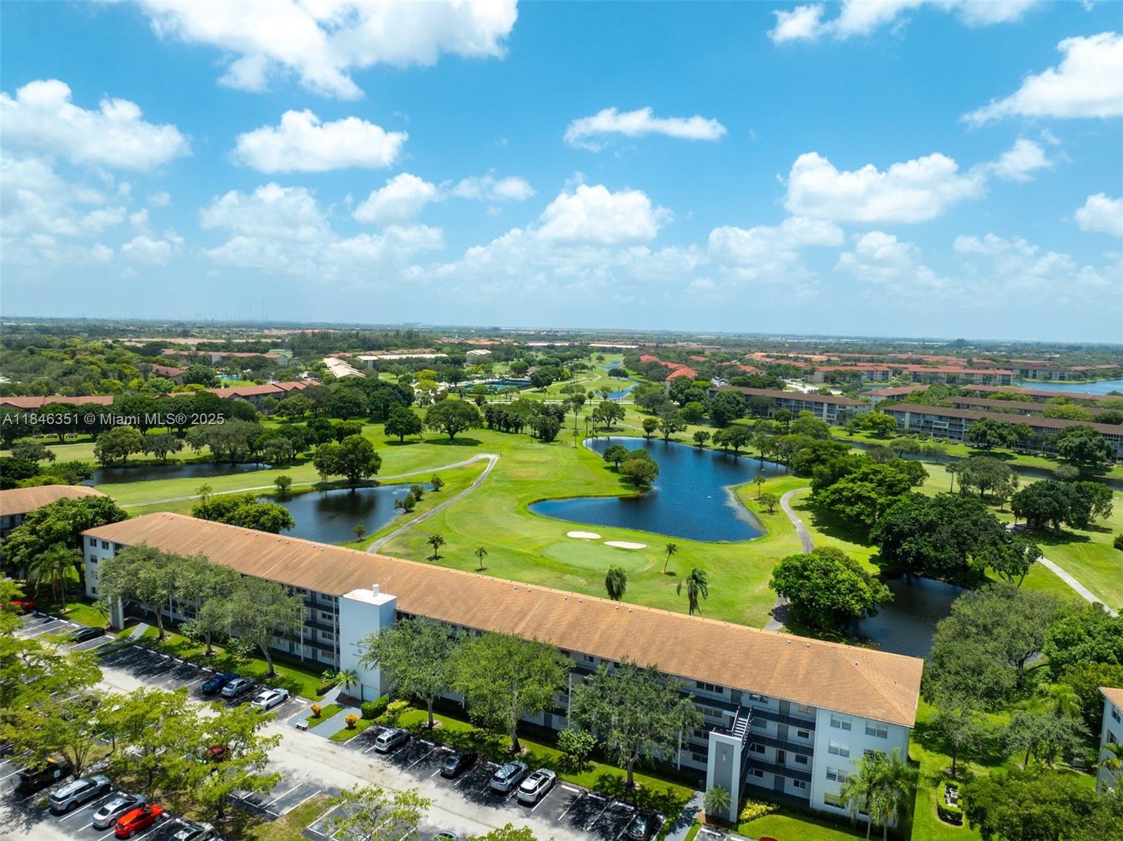 Welcome to your personal paradise in Century Village, a gated 55+ resort community! This 1 bed / 1.5 bath unit features stunning golf and lagoon views, a 2022 AC, 2023 refrigerator, and 2025 water heater. Wood laminate and tile floors throughout. Includes one assigned parking space and plenty of guest parking. Well-maintained building with new elevator and roof. Enjoy resort-style amenities: clubhouse, theater, pools, gyms, tennis & more. HOA covers cable, internet, and water. Reserves in place, no special assessments. 690 min credit score. No rental restrictions—rent immediately! Furniture included if buyer chooses.