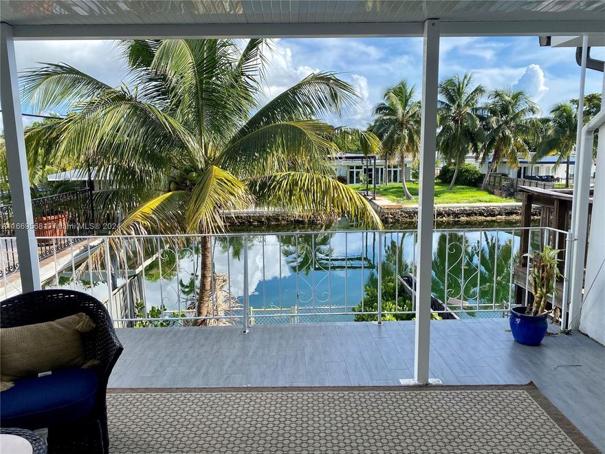 Move right in and enjoy this centrally located, recently renovated, unfurnished 2-bedroom, 2.5-bath waterfront two story townhouse. This home offers a spacious living room and family room (that can be used as the third bedroom), impact-resistant windows and doors, wood and porcelain flooring, and a modern open kitchen with quartz countertops and stainless steel appliances. The large master suite on the second floor boasts a generous terrace with stunning water views. The peaceful, private backyard backs onto a serene canal. Boats up to 30 ft can be parked at remote controlled lift. No association approval is required.