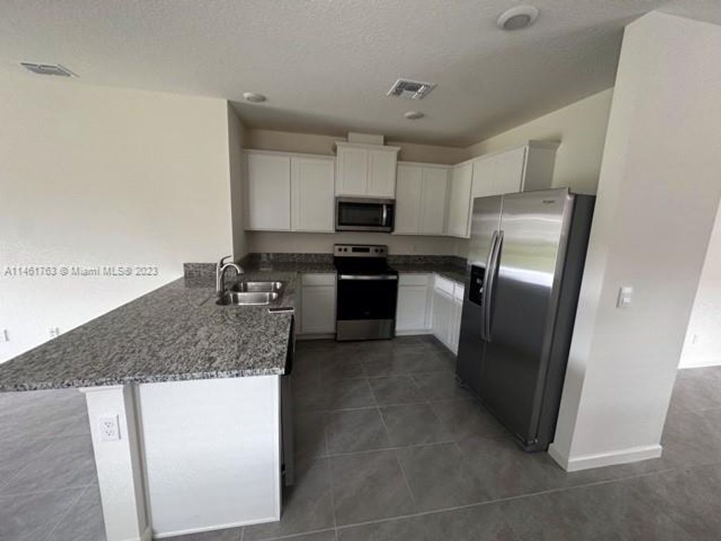 Photo of 12271 SW Rimini Way, Port Saint Lucie, FL 34987 (MLS # A11461763)