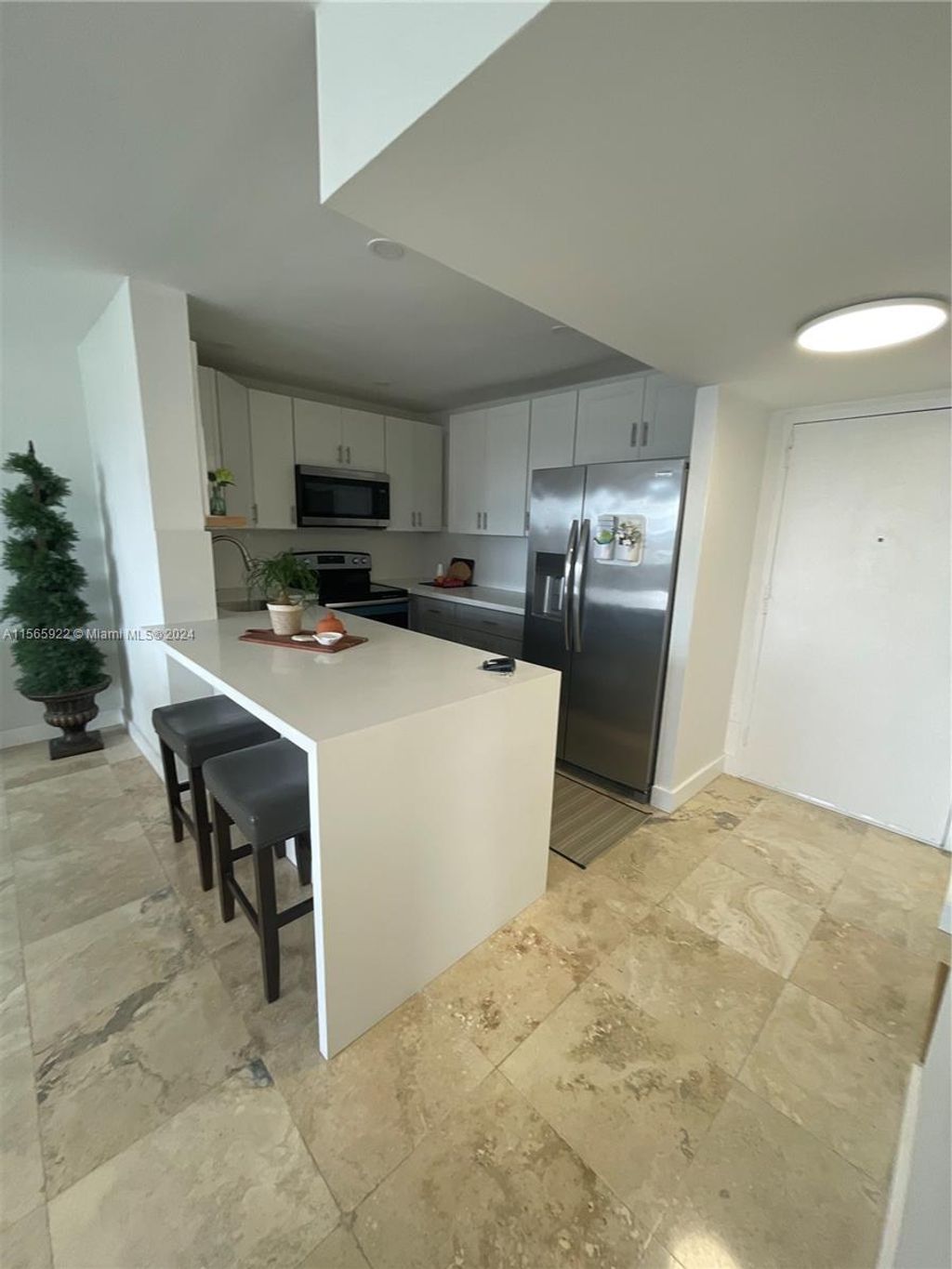 Photo of 401 Golden Isles Dr #1111, Hallandale Beach, FL 33009 (MLS # A11565922)