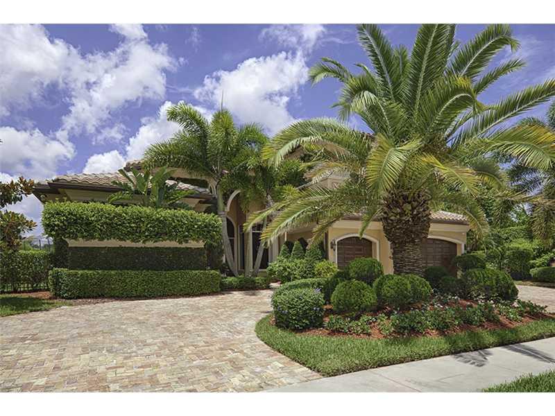 Experience sophisticated contemporary living in this 5bdrm/6.5bths,private offc & loft/plyrm home*Walls of glass open to panoramic water & fountain vws*Master ste,private offc & gust ste are located downstairs*Wood & iron staircase lead to 3 additional bd rm stes plus loft/plyrm upstrs*Marble flooring in main areas & hardwood in all bdrms architectural ceiling details thrghot*Chefs ktchn w/large island & 6 burner gas stove*Impact windows & doors huge marble lanai & heated pool & spa  makes this a MUST SEE!