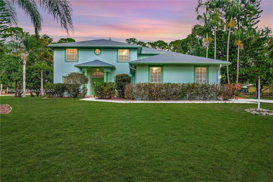 Discover your family's dream home with this one-owner, beautifully maintained 5-bedroom plus office, 3-bathroom Jupiter Farms property. Move-in ready, with endless potential for cosmetic updates to suit your style. The spacious open kitchen with upgraded appliances flows seamlessly into a light-filled great room, ideal for entertaining. The expansive primary suite boasts his and her walk in closets, dual vanities, a standalone shower, Jacuzzi tub and private water closet. Step outside to a large screened-in pool, covered patio and cabana bath, all set on an oversized 1.3+ acre lot adorned with Palm, Pine and fruit trees. Enjoy peace of mind with a new roof, gutters and water system. Additional highlights include a 3-car garage and high-and-dry corner lot. Your perfect family retreat awaits