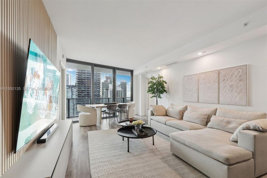 Experience elevated hotel-style living at SLS Lux Residences, where luxury, convenience, and world-class amenities converge in the heart of Brickell. Enjoy the exclusivity of a private elevator entry into this 38th-floor, south-facing residence, offering breathtaking panoramic views of the Miami skyline and the Atlantic Ocean. This meticulously maintained 2-bedroom plus den, 2.5-bath condo features thoughtful upgrades designed to enhance both comfort and functionality. Highlights include a custom built-in TV entertainment center, contemporary tile kitchen backsplash, pocket door enclosure for the den to maximize versatility, and a fully customized 8' x 5' built-in closet in the guest bedroom. Additional enhancements include installed overhead lighting in the living areas and a newly updated mirror in the primary bathroom for a refreshed, modern feel. Residents enjoy true full-service, hotel-style living with access to a resort-style pool with an on-site restaurant, a private residents-only rooftop pool, state-of-the-art fitness center, spa, and curated lifestyle amenities synonymous with the SLS brand. Located just steps from Brickell City Centre, Mary Brickell Village, and Miami’s top dining, shopping, and nightlife, this home delivers an unmatched lifestyle of luxury and walkable convenience. No active special assessments. Settlement was reached in 2025, providing added peace of mind.