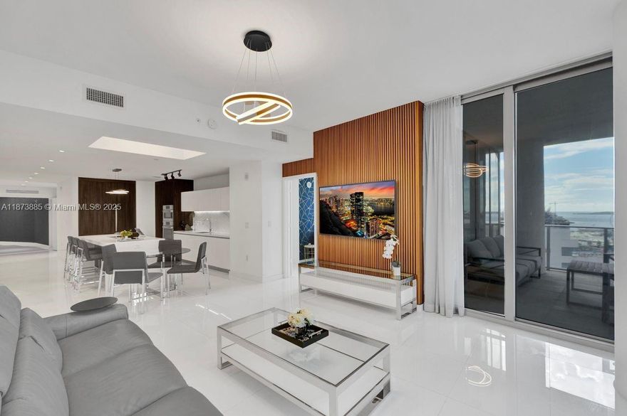 Welcome to the absolute best deal for a 3bed/4bath plus fully enclosed den corner unit with partial water views, private foyer and elevator at Paramount Miami World Center. Features include: electric blinds throughout the unit, 10 ft high ceilings, Italian kitchen w/Sub Zero & Bosch appliances, Marble kitchen backsplash, white porcelain tile floors, floor to ceiling windows, fully enclosed den into a 4th bedroom, recessed lighting, upgraded TV wall & light fixtures, large terrace space,, spacious master bedroom with water view, huge upgraded closets, spa like master bath with dual vanities with views of the water, spacious 2nd & third bedrooms with water views.  Have access to resort like amenities including: 5 pools, gym, tennis, boxing as well as world class restaurants & shopping.