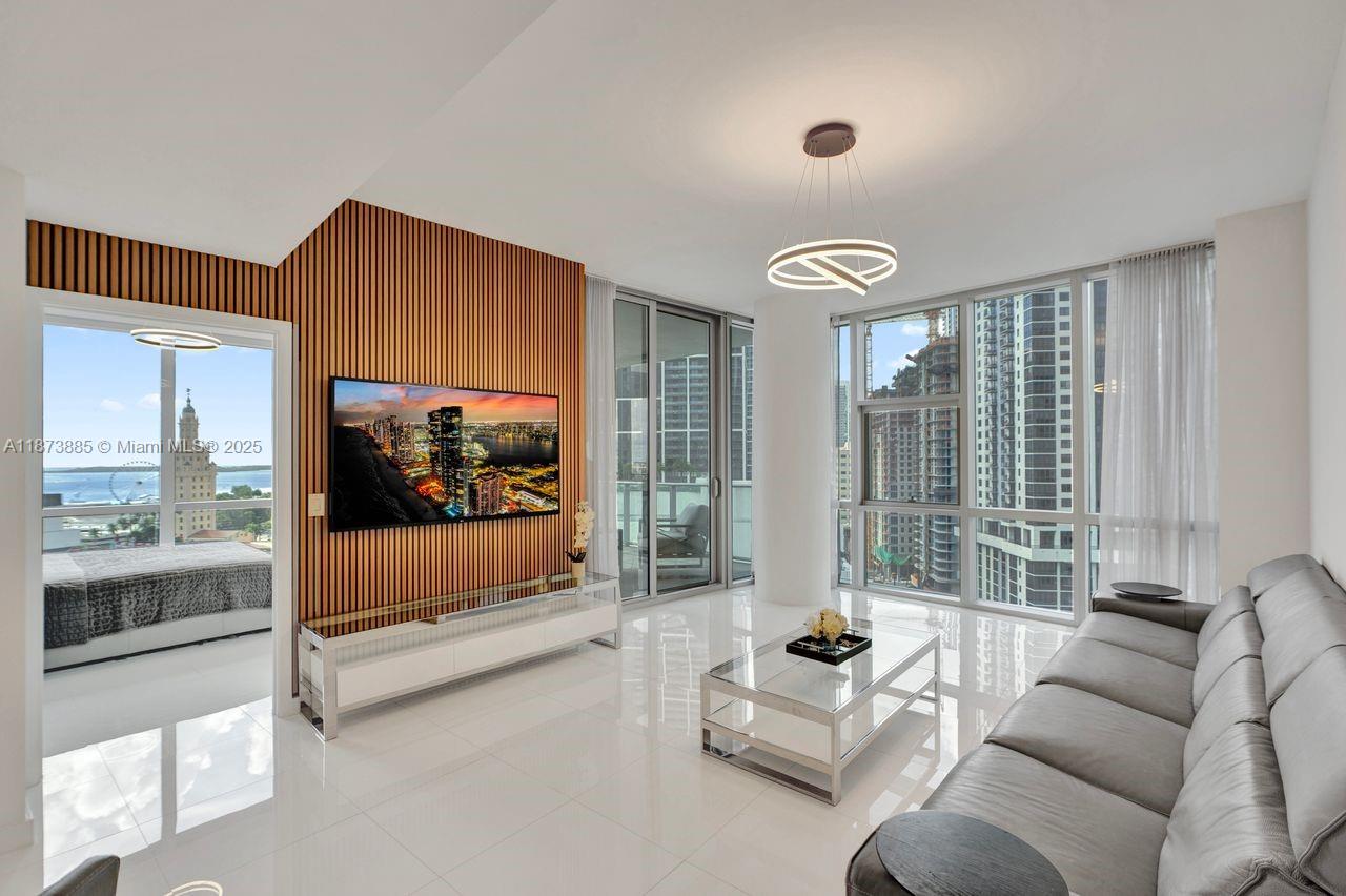 Welcome to the absolute best deal for a 3bed/4bath plus fully enclosed den corner unit with partial water views, private foyer and elevator at Paramount Miami World Center. Features include: electric blinds throughout the unit, 10 ft high ceilings, Italian kitchen w/Sub Zero & Bosch appliances, Marble kitchen backsplash, white porcelain tile floors, floor to ceiling windows, fully enclosed den into a 4th bedroom, recessed lighting, upgraded TV wall & light fixtures, large terrace space,, spacious master bedroom with water view, huge upgraded closets, spa like master bath with dual vanities with views of the water, spacious 2nd & third bedrooms with water views. Have access to resort like amenities including: 5 pools, gym, tennis, boxing as well as world class restaurants & shopping.