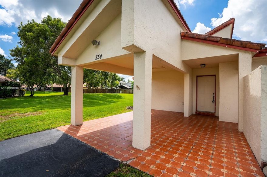 Beautiful large corner 1-story villa with 2 beds & 2 baths! Features a carport, long driveway, front garden patio, and spacious screened back patio. Interior boasts tile floors throughout, a renovated kitchen, cozy coffee/bar area, full-size washer & dryer, and 5 sliding doors for bright indoor-outdoor living. Community offers pool, tennis & basketball courts, and plenty of guest parking. Prime location near highways, A-rated schools & restaurants. **New roof coming in 2026—owner paying special assessment in FULL at closing ($26,500 value)!** HOA budget attached includes insurance, water/sewer, security and reserves. Jacuzzi in patio can be included in sale for $7,000.00 additional, cost $21,000 when installed in 2023.