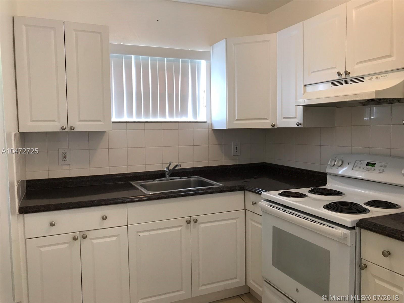 UPDATED, 2/2 rear apartment is 860 SF unit UNFURNISHED. Unit features 2 bedrooms and 2 full bathrooms, 2 PARKING SPOTS. Nice size updated kitchen and new appliances. Nice living room/dining room area. Each MASTER bedroom can fit a king size and a has nice size closet. Central A/C. Washer & Dryer in unit, clean and well maintained unit is centrally located and in a quiet, safe neighborhood, close to I-95, turnpike, airport, shopping, schools & 5 minutes from the beach. $65 credit/background check, must have documented & verifiable income. Lawn maintenance included in rent. First, last & security deposit. Fast approvals 3-4 days Lawn maintenance included in rent.