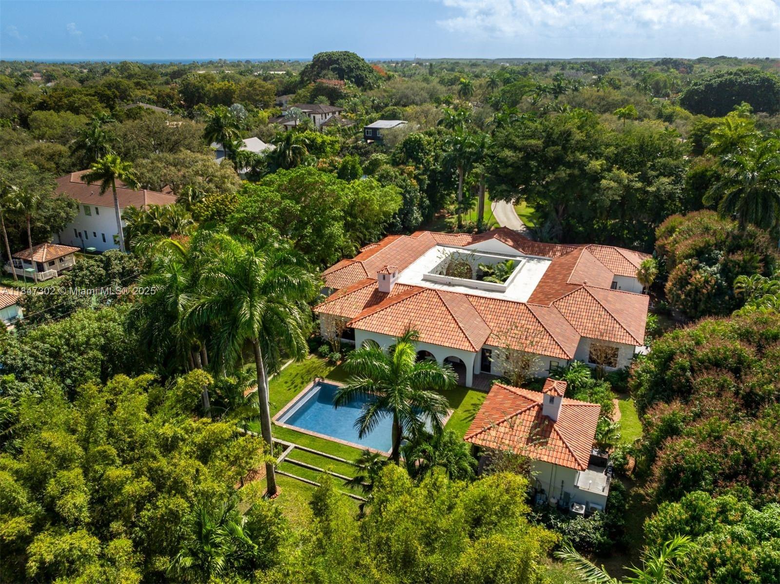 A one-of-a-kind Grand Classic Montecito Estate in Ponce Davis. Offering privacy, sophistication, and modern convenience, this 9,449 Sq Ft, 7BD 6BA home by architect Jenifer Briley and designer Deborah Houston boasts lush landscaping with mature trees and a front entrance courtyard. Inside are custom architectural details, reclaimed French oak floors, custom high-impact Marvin windows and Signature Doors, and a large fireplace, adding timeless charm. A chef’s kitchen features top-tier appliances, and the spacious principal suite offers a spa-like bath and custom walk-in closet. Outdoor spaces include a saltwater pool with jacuzzi, summer kitchen, and covered terraces with exposed wood beams. Smart home automation, a 3-car garage, and luxurious finishes complete this exceptional retreat.