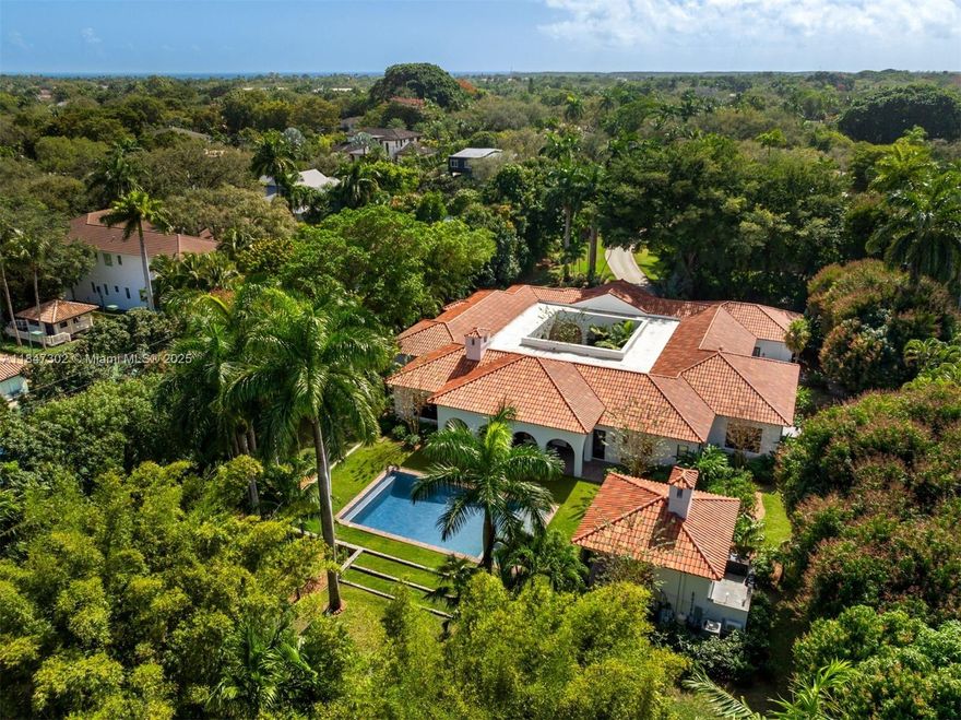 A one-of-a-kind Grand Classic Montecito Estate in Ponce Davis. Offering privacy, sophistication, and modern convenience, this 9,449 Sq Ft, 7BD 6BA home by architect Jenifer Briley and designer Deborah Houston boasts lush landscaping with mature trees and a front entrance courtyard. Inside are custom architectural details, reclaimed French oak floors, custom high-impact Marvin windows and Signature Doors, and a large fireplace, adding timeless charm. A chef’s kitchen features top-tier appliances, and the spacious principal suite offers a spa-like bath and custom walk-in closet. Outdoor spaces include a saltwater pool with jacuzzi, summer kitchen, and covered terraces with exposed wood beams. Smart home automation, a 3-car garage, and luxurious finishes complete this exceptional retreat.
