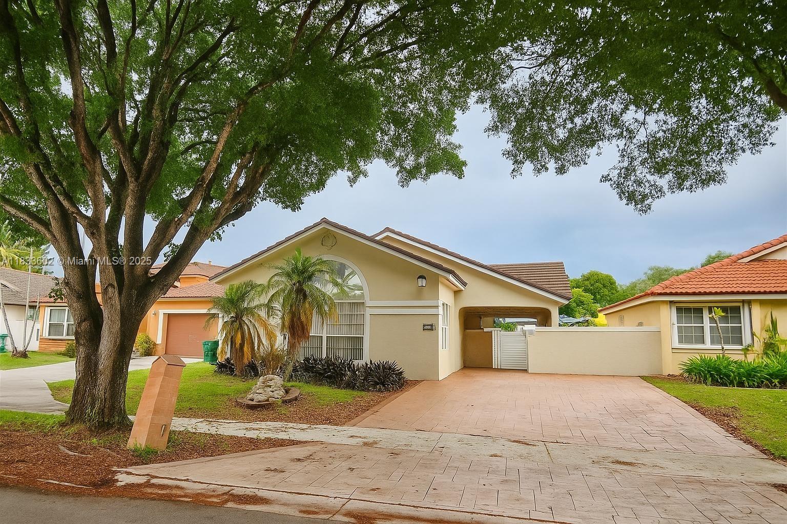 Beautiful 3/2.5 single-family home with a pool in Miami Lakes. This spotless and upgraded home features a 4-year-old roof and is located in a cul-de-sac, offering extra privacy and minimal traffic. The master bedroom is conveniently located downstairs. Enjoy a spacious pool area with a hot tub and pool heater, perfect for gatherings. The home is filled with natural light from several skylights and boasts high ceilings. The fully renovated open kitchen includes new large countertops and stainless-steel appliances. Tile floors cover the first floor, while the second floor features wood flooring. An extended driveway accommodates over four cars. No association fees!